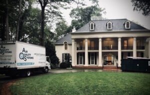 an Air Quality Systems truck outside a client's home before performing an HVAC cleaning service