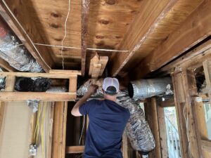 professionals cleaning an air system