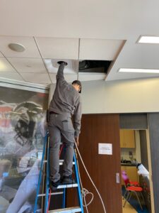 an HVAC technician cleaning air ducts